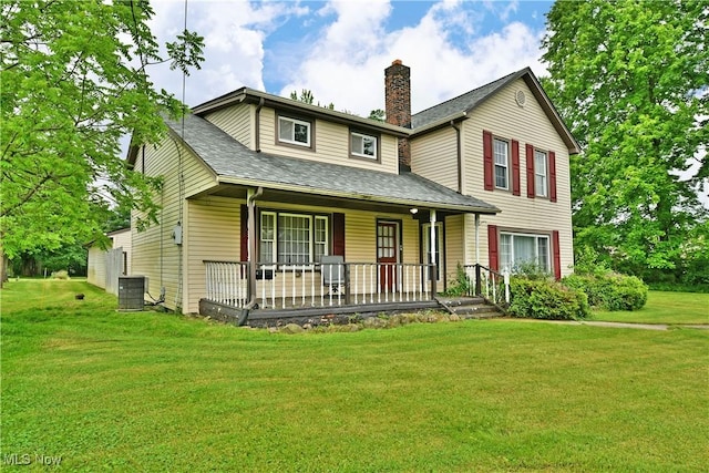 895 Elmwood Dr, Hubbard, OH 44425 - view of front facade featuring a porch, a chimney, a front lawn, a shingled roof, and central air condition unit