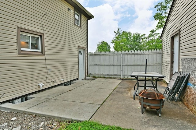 895 Elmwood Dr, Hubbard, OH 44425 - view of patio with an outdoor fire pit