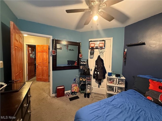 20007 Sunset Dr, Warrensville Heights, OH 44122 - bedroom featuring carpet flooring, a ceiling fan, and a closet