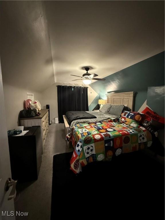 20007 Sunset Dr, Warrensville Heights, OH 44122 - bedroom featuring lofted ceiling, carpet flooring, and a ceiling fan