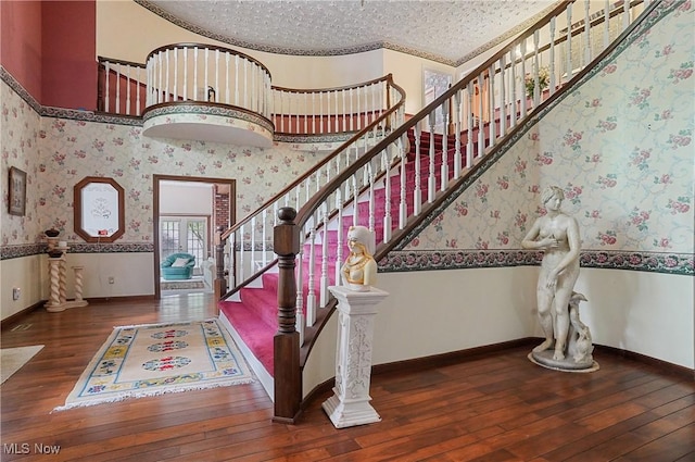 8650 Hidden Hills Dr SE, Howland, OH 44484 - staircase with wood-type flooring and wallpapered walls