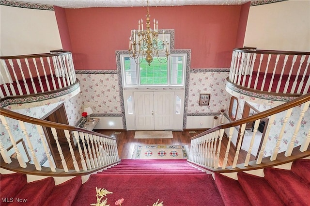 8650 Hidden Hills Dr SE, Howland, OH 44484 - entrance foyer featuring wood finished floors, wallpapered walls, stairway, and a chandelier