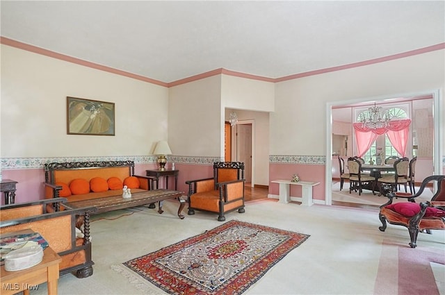 8650 Hidden Hills Dr SE, Howland, OH 44484 - carpeted living room featuring a chandelier and crown molding