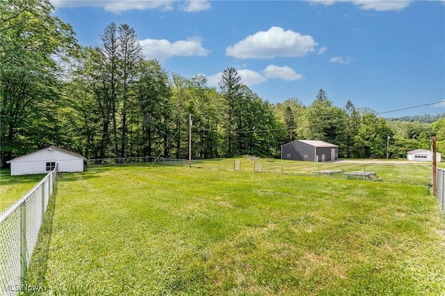 10790 Good Hope Pike, Jane Lew, WV 26378 - view of yard featuring an outdoor structure, a wooded view, an outbuilding, and a garage