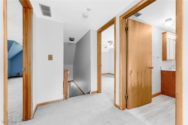 10790 Good Hope Pike, Jane Lew, WV 26378 - corridor with an upstairs landing, light colored carpet, baseboards, and a sink