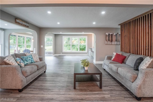 680 Isle View Dr, Akron, OH 44319 - living room featuring arched walkways, recessed lighting, baseboards, and wood finished floors