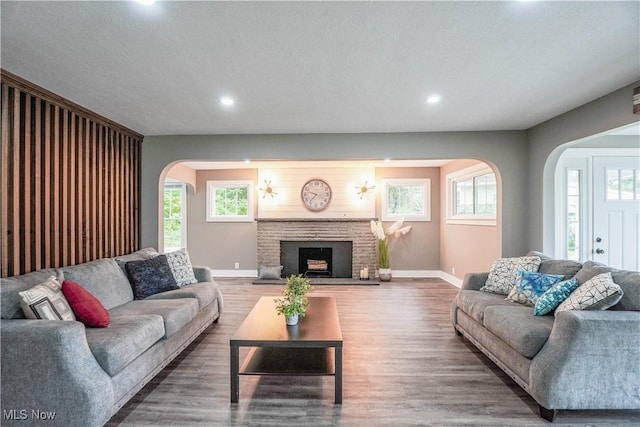 680 Isle View Dr, Akron, OH 44319 - living room featuring arched walkways, baseboards, recessed lighting, and healthy amount of natural light