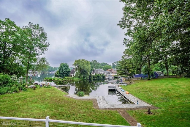 680 Isle View Dr, Akron, OH 44319 - surrounding community with a water view, a dock, a lawn, and a boat ramp