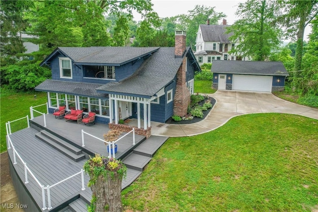 680 Isle View Dr, Akron, OH 44319 - view of front of house with roof with shingles, a deck, a chimney, a front yard, and outdoor lounge area