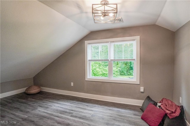 680 Isle View Dr, Akron, OH 44319 - bonus room featuring vaulted ceiling, wood finished floors, baseboards, and a chandelier