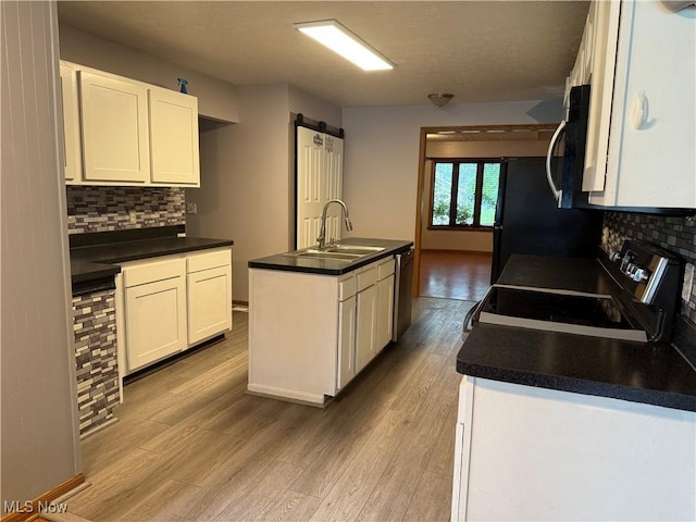 7687 Galena St NW, Massillon, OH 44646 - kitchen with a sink, stainless steel appliances, decorative backsplash, and dark countertops