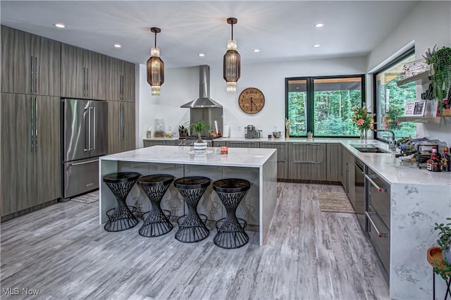 4385 Good Rd, Seville, OH 44273 - kitchen with stainless steel appliances, wall chimney range hood, modern cabinets, a sink, and recessed lighting