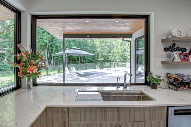 4385 Good Rd, Seville, OH 44273 - kitchen with stainless steel dishwasher, modern cabinets, and plenty of natural light