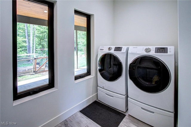 4385 Good Rd, Seville, OH 44273 - washroom with washer and dryer, light wood finished floors, and baseboards