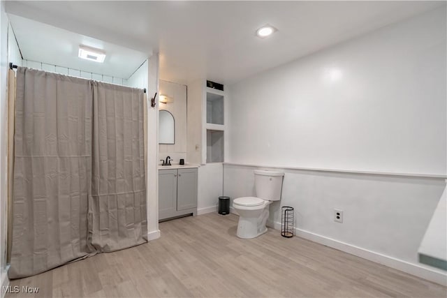 6226 Mayburn Barclay Rd, Kinsman, OH 44428 - bathroom featuring wood finished floors, vanity, toilet, a shower with curtain, and baseboards