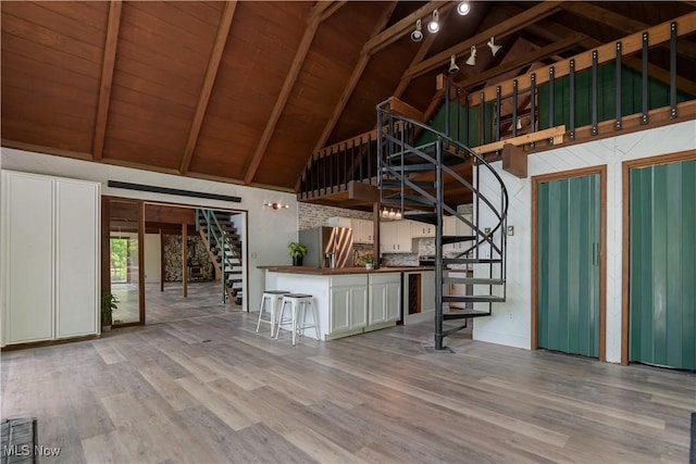6226 Mayburn Barclay Rd, Kinsman, OH 44428 - unfurnished living room featuring stairway, wood finished floors, high vaulted ceiling, and wooden ceiling with exposed beams