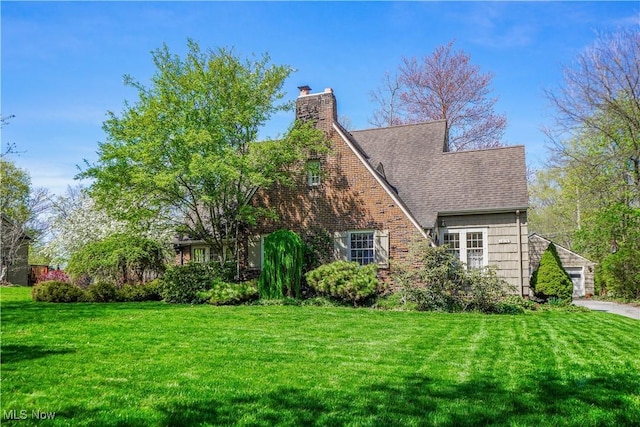 1415 Inwood Rd, Alliance, OH 44601 - view of front of property featuring a front lawn, a chimney, and roof with shingles