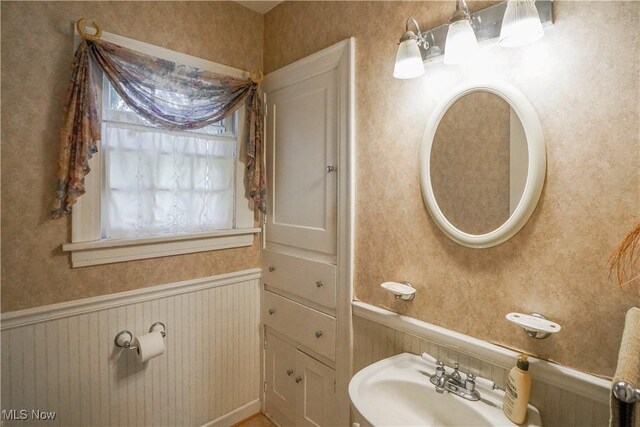 1415 Inwood Rd, Alliance, OH 44601 - bathroom with a wainscoted wall and a sink