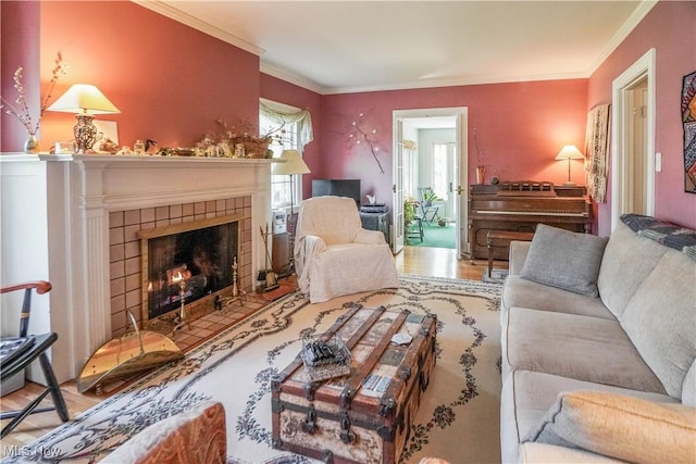 1415 Inwood Rd, Alliance, OH 44601 - living area with wood finished floors, crown molding, and a tiled fireplace