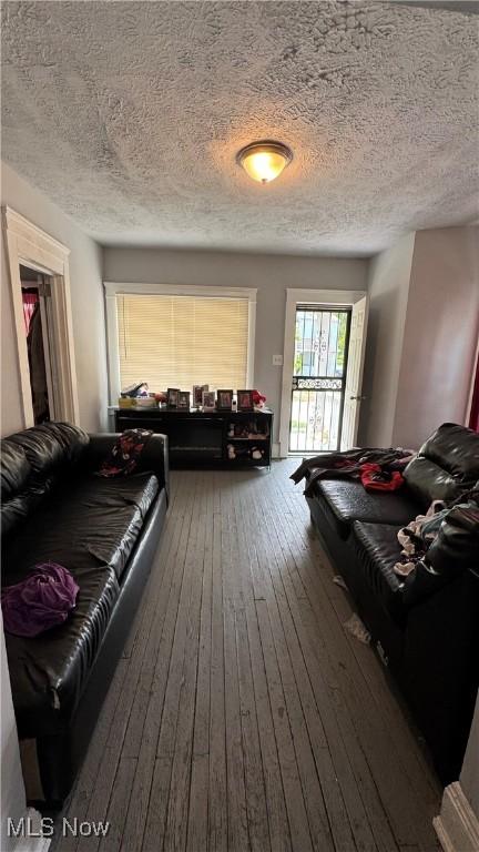 3415 E 114th St, Cleveland, OH 44104 - living room featuring hardwood / wood-style floors and a textured ceiling
