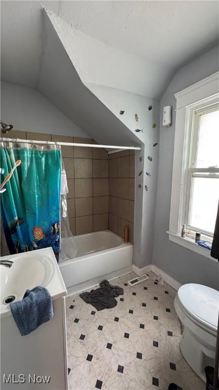 3415 E 114th St, Cleveland, OH 44104 - full bathroom with vaulted ceiling, vanity, shower / bathtub combination with curtain, and toilet