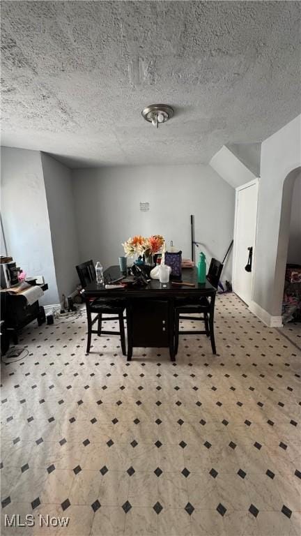 3415 E 114th St, Cleveland, OH 44104 - dining area featuring baseboards and a textured ceiling