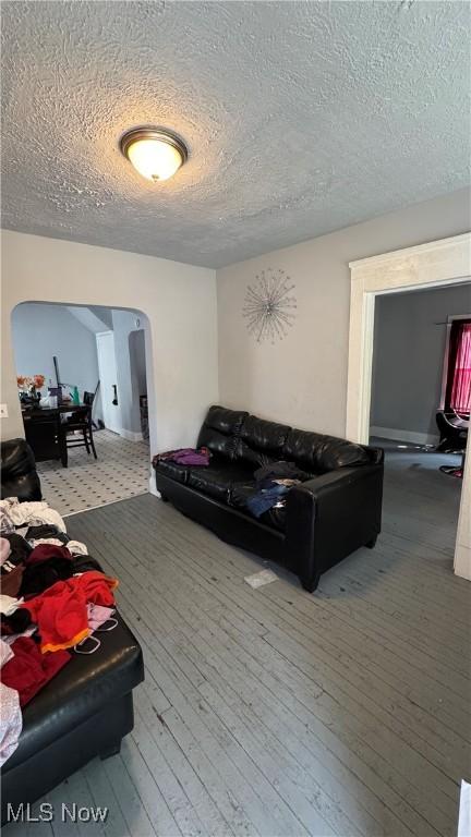3415 E 114th St, Cleveland, OH 44104 - living room with hardwood / wood-style floors and a textured ceiling