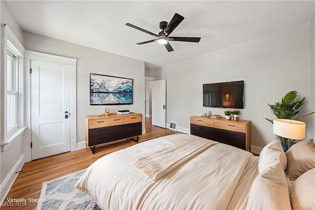3020 E Derbyshire Rd, Cleveland Heights, OH 44118 - bedroom featuring wood finished floors, baseboards, and a ceiling fan