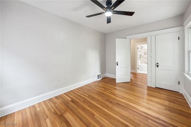 3020 E Derbyshire Rd, Cleveland Heights, OH 44118 - unfurnished bedroom with baseboards, light wood finished floors, and a ceiling fan