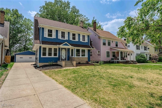 3020 E Derbyshire Rd, Cleveland Heights, OH 44118 - view of front of property featuring an outbuilding, a detached garage, a front lawn, and a chimney
