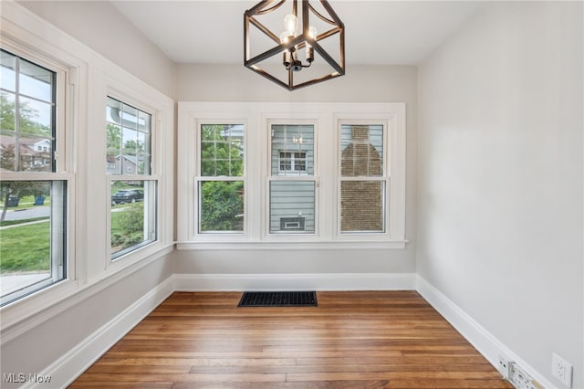 3020 E Derbyshire Rd, Cleveland Heights, OH 44118 - unfurnished sunroom with a chandelier