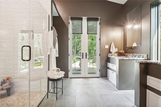7090 Country Ln, Chagrin Falls, OH 44023 - bathroom featuring vanity, a stall shower, french doors, and tile patterned floors