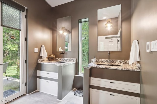 7090 Country Ln, Chagrin Falls, OH 44023 - full bath featuring two vanities and baseboards