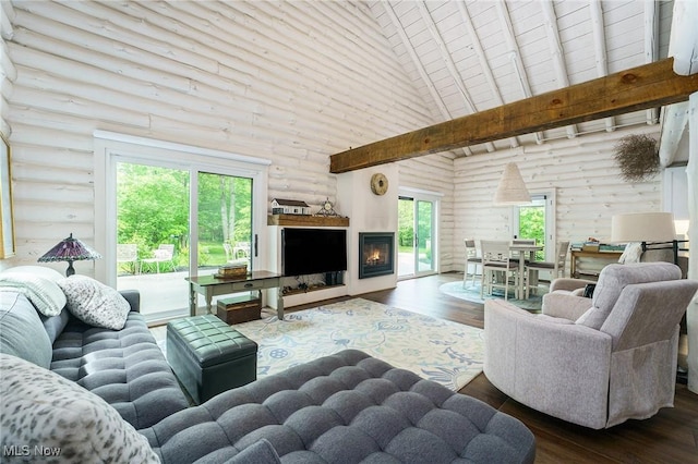 7090 Country Ln, Chagrin Falls, OH 44023 - living area featuring high vaulted ceiling, log walls, hardwood / wood-style floors, and a glass covered fireplace