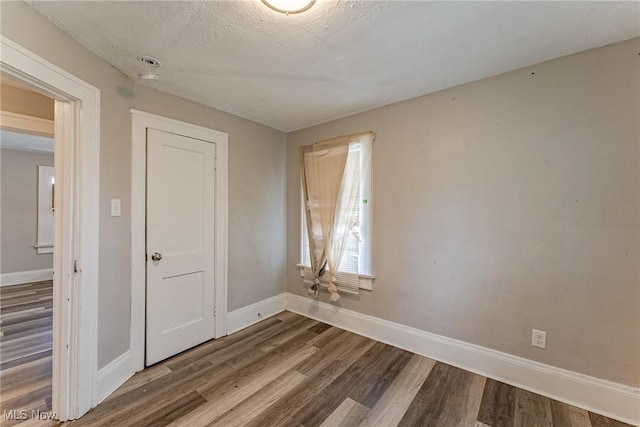 906 Beardsley St, Akron, OH 44311 - unfurnished room with wood finished floors and baseboards