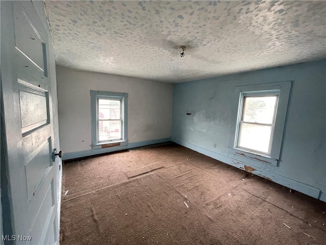 1400 Center St, Wellsville, OH 43968 - carpeted spare room with a textured ceiling and baseboards