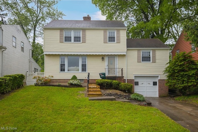 3762 Covington Rd, South Euclid, OH 44121 - colonial home with a garage, concrete driveway, and a chimney