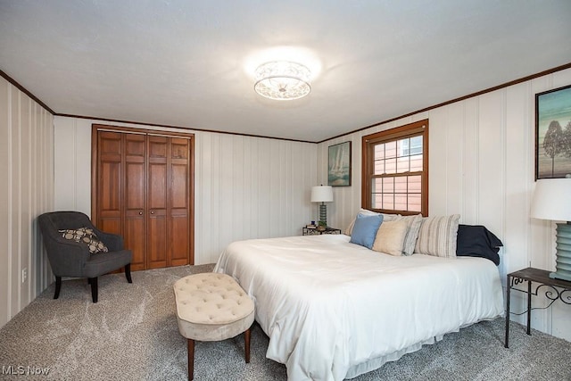 3762 Covington Rd, South Euclid, OH 44121 - bedroom with ornamental molding, carpet, a closet, and a decorative wall