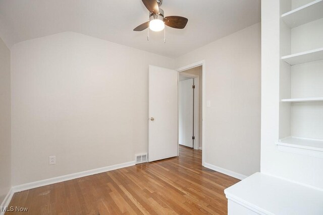 3762 Covington Rd, South Euclid, OH 44121 - unfurnished room with ceiling fan, light wood-style flooring, baseboards, and built in features