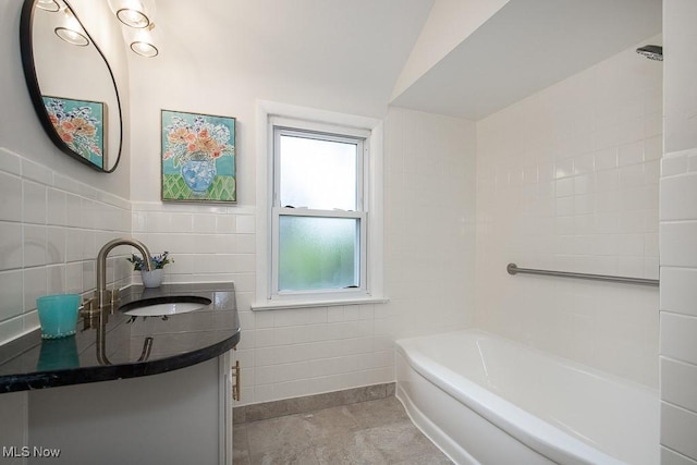 3762 Covington Rd, South Euclid, OH 44121 - full bathroom featuring a bath, vanity, and tile walls