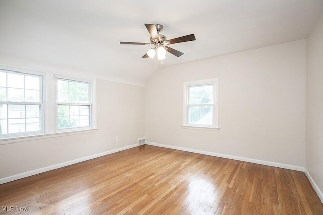 3762 Covington Rd, South Euclid, OH 44121 - spare room featuring healthy amount of natural light, baseboards, light wood-style floors, vaulted ceiling, and ceiling fan