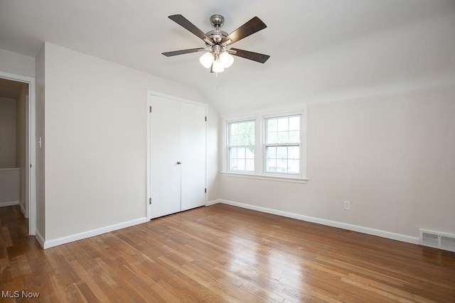 3762 Covington Rd, South Euclid, OH 44121 - unfurnished bedroom with vaulted ceiling, wood finished floors, baseboards, and ceiling fan
