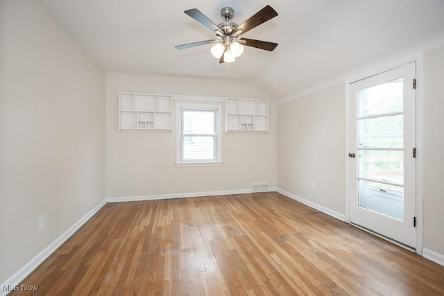 3762 Covington Rd, South Euclid, OH 44121 - empty room with light wood-style flooring, ceiling fan, baseboards, and lofted ceiling