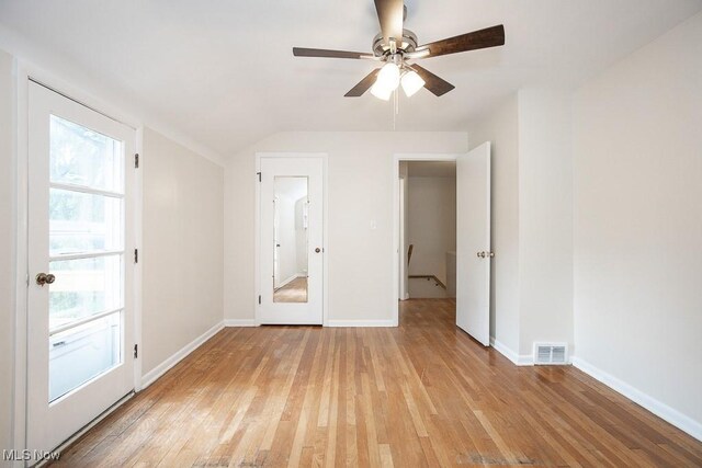3762 Covington Rd, South Euclid, OH 44121 - unfurnished bedroom featuring light wood-type flooring, vaulted ceiling, baseboards, and a ceiling fan
