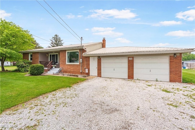 22938 US Route 30, Minerva, OH 44657 - ranch-style home with a front lawn, brick siding, a chimney, and a garage