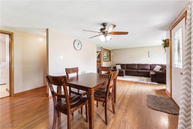 22938 US Route 30, Minerva, OH 44657 - dining room featuring light wood-style flooring, a ceiling fan, and baseboards