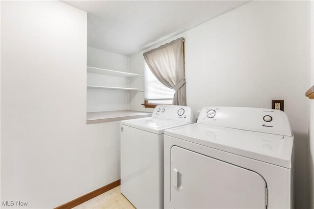 22938 US Route 30, Minerva, OH 44657 - washroom featuring separate washer and dryer, light floors, and baseboards