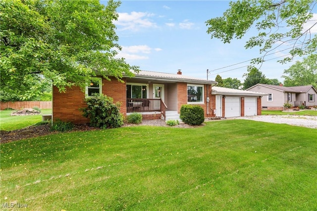 22938 US Route 30, Minerva, OH 44657 - single story home with a porch, a chimney, brick siding, driveway, and an attached garage