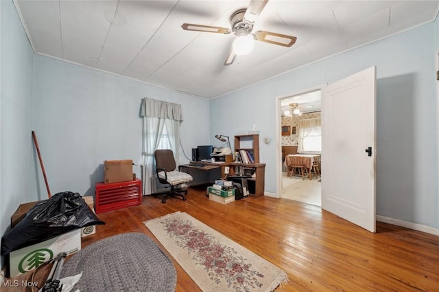 7100 Barton Rd, North Olmsted, OH 44070 - home office with wood finished floors, a ceiling fan, and crown molding