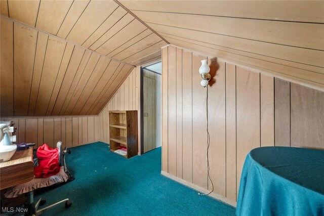 7100 Barton Rd, North Olmsted, OH 44070 - bonus room with vaulted ceiling, wood walls, and carpet